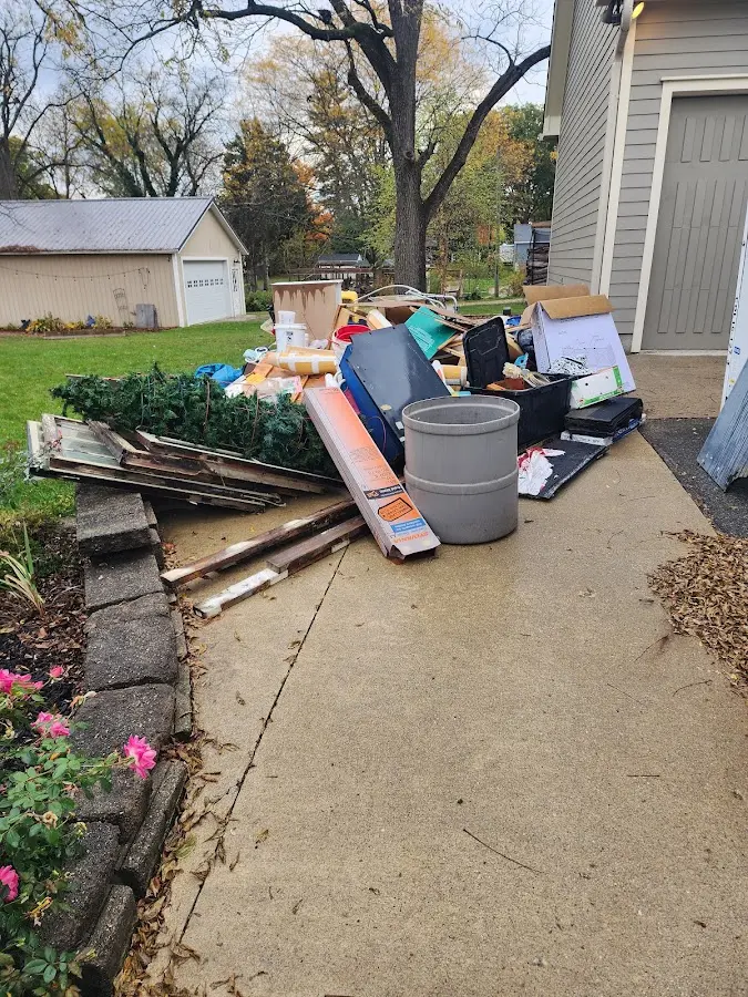 Dumpster being loaded with debris for 3 Yard Dumpster Rental in Azalea Park